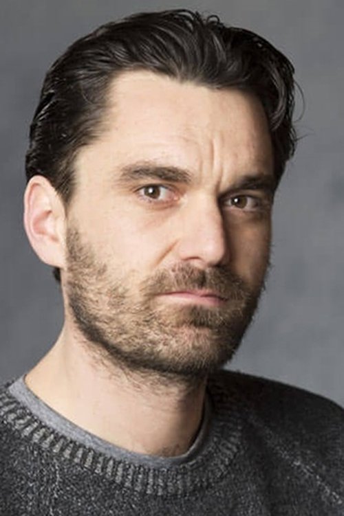 Gray Powell as Father in ARQ