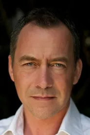 Dominic Mafham as Dr. Malcolm Betruger in Doom: Annihilation