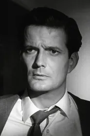 John Merivale as Maj. Sylvester Pennington Sloane in Arabesque