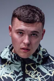 Mo Chara as Mo Chara Or Liam Óg in Kneecap