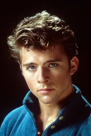 Maxwell Caulfield as Michael Carrington in Grease 2