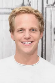 Chris Geere as Roger Clifford in Pokémon Detective Pikachu